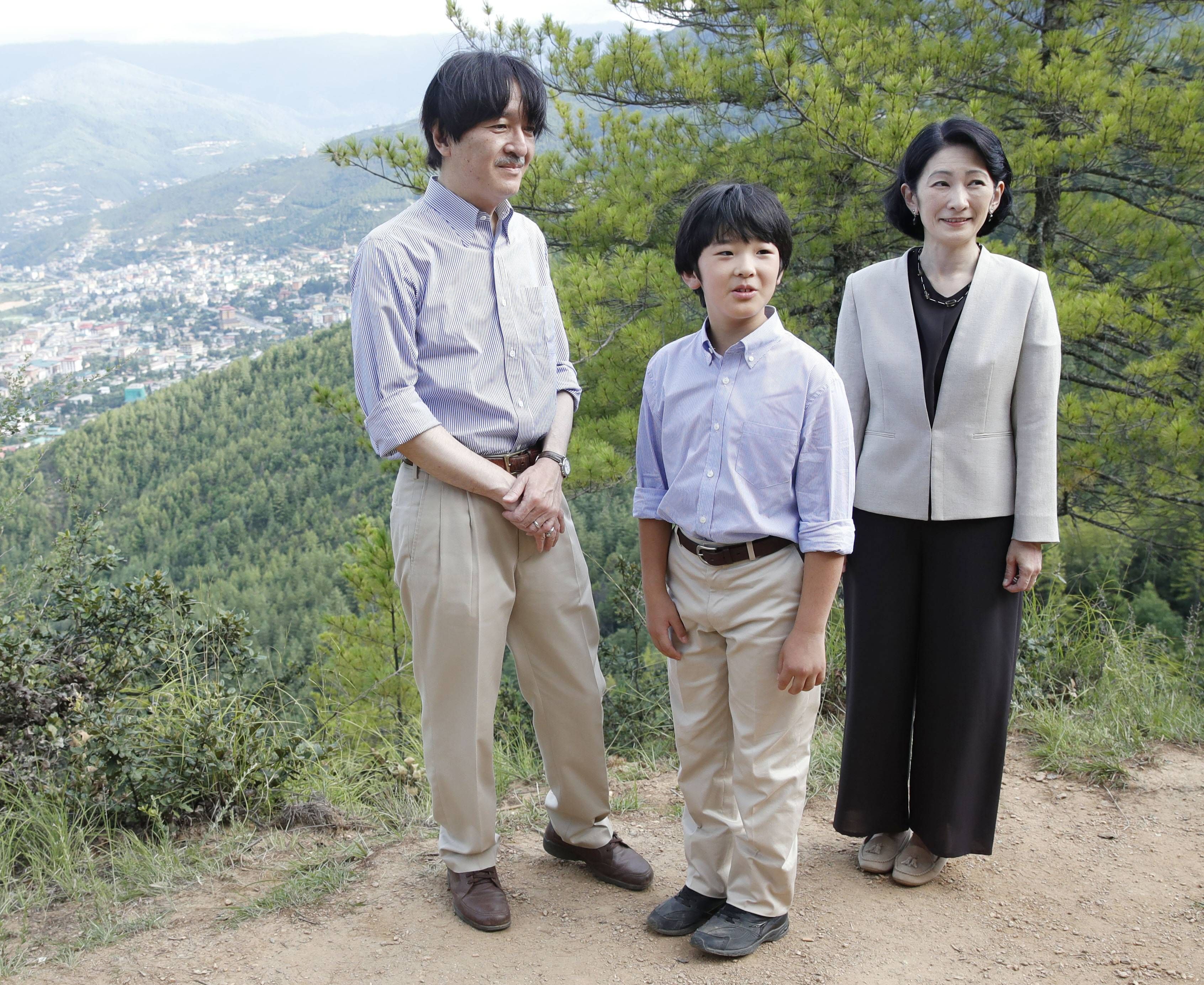 Japanese crown prince s family in Bhutan Japanese Prince Hisahito (C) and his parents Crown Prince Fumihito and Crown Princess Kiko pose for a photo on a hiking trail in Thimphu, the capital of Bhutan, on Aug. 20, 2019. 