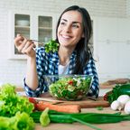 Woman eating vegan salad