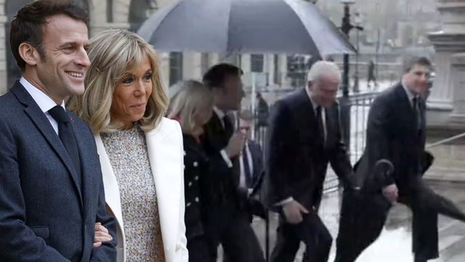 Romantische Szenen unter dem Regenschirm – sie schmiegt sich an den Präsidenten 